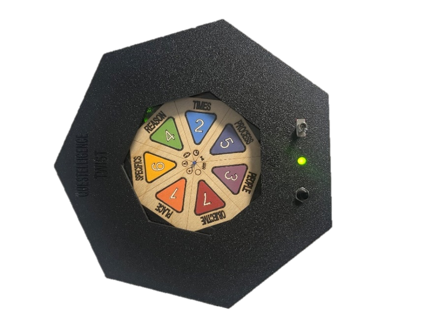 Photograph of the assembled black heptagonal Mechatronic Spinner with a colour-coded central plate